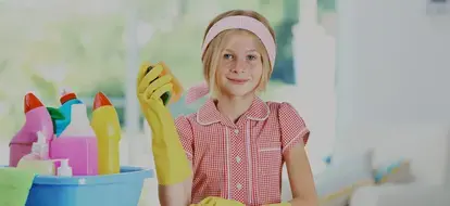 Young girl with cleaning supplies
